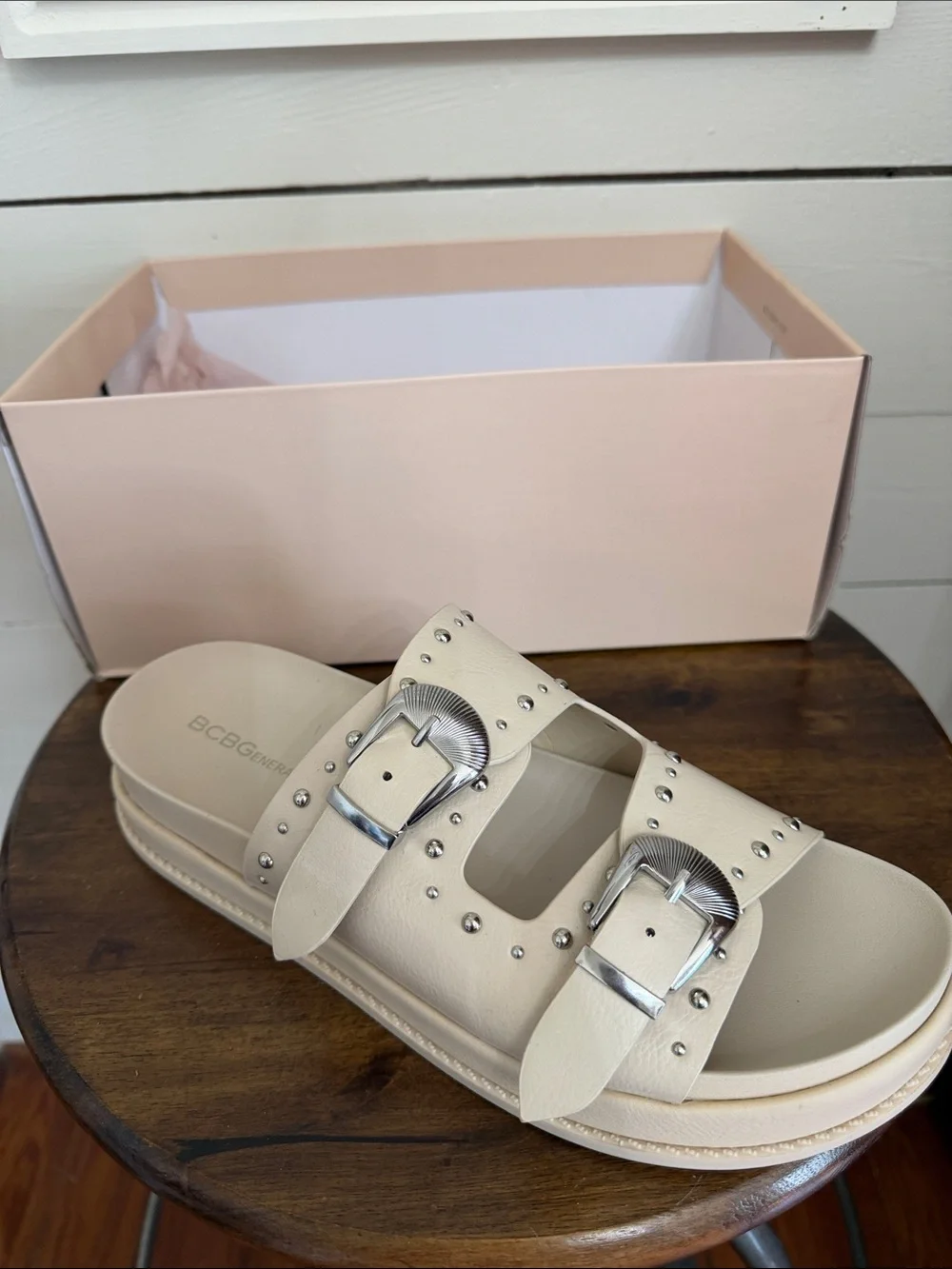 BCBGeneration Ivory Slide Sandals with Silver Buckles